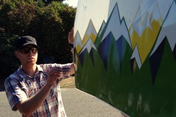 Andreas putting on the WeighMyRack Camper Wrap